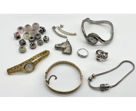 A collection of jewellery including silver, rolled gold hinged bracelet and a Rona Sutton bracelet and charms etc.