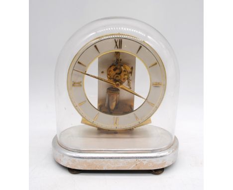 A Junghans mantel clock, with glass domed cover