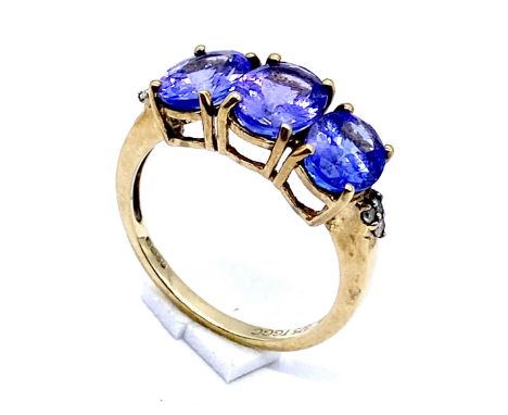 A 375 gold three stone oval tanzanite ring, Size O, 3.0 grams total.