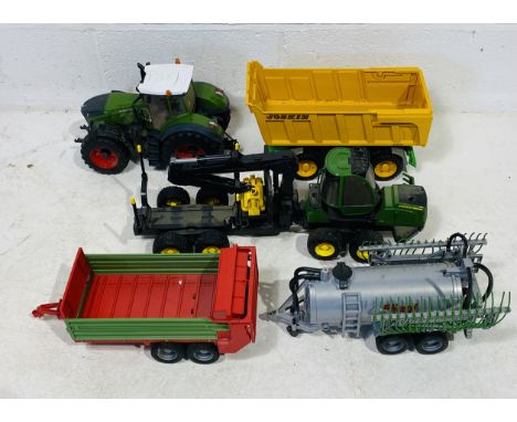 A collection of unboxed farming related Bruder toys including Fendt 1050 tractor, Fliegl manure tank spreader, John Deere for