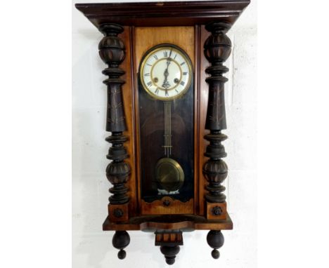 An antique mahogany cased wall clock with enamelled dial, 80cm length, missing pediment.
