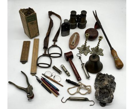 A collection of various items including tools, pens, antique child's stirrups, brass candlesticks, binoculars etc.