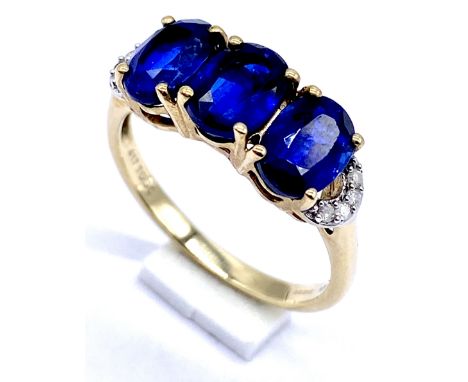 A 10K/375 gold sapphire and diamond ring Size N 1/2, 2.9 g total.
