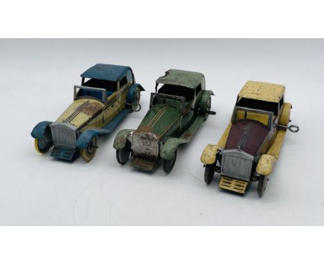 Three vintage Wells Brimtoy (London) Rolls Royce Coupe de Ville tinplate clockwork cars with chauffeur and keys
