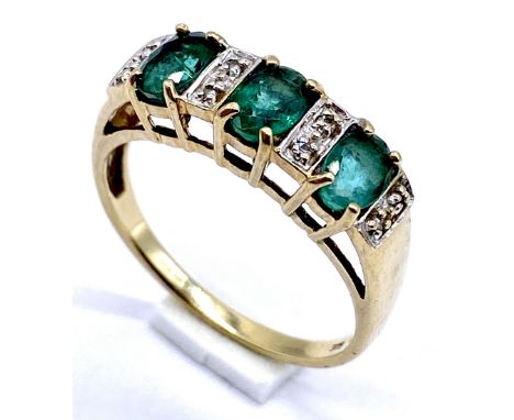 A 9ct gold emerald 3 stone ring with diamond infills, size T 1/2