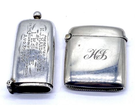 A hallmarked silver vesta case along with a silver sovereign case combination vesta (A/F)