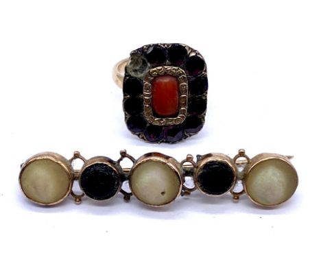Two pieces of antique gold jewellery- a Georgian ring (converted brooch) set with coral and garnets (1 missing) on 9ct band a