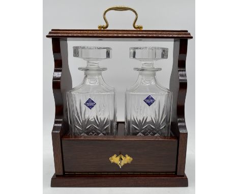 A modern two bottle lockable tantalus with Edinburgh crystal decanters