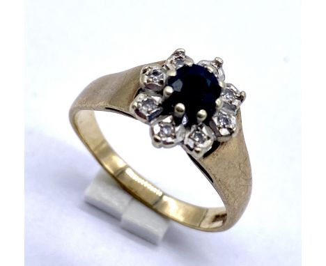 A 9ct gold diamond and sapphire cluster ring, size R, weight 3.6g