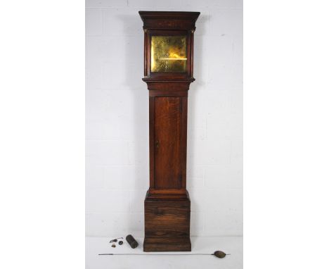 An antique oak cased longcase clock with brass dial named to 'Tho Fowle, Hastings', with key - some parts loose but present -