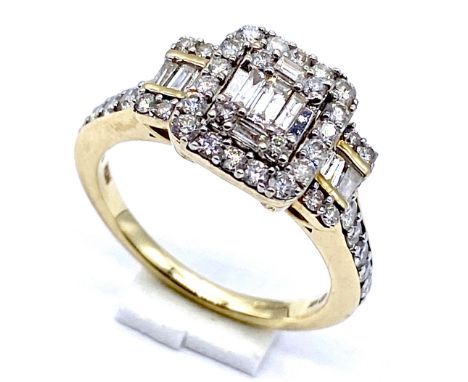 A 14K gold and diamond brilliant cut and baguette cut dress ring, size O, 4.7 grams in total.