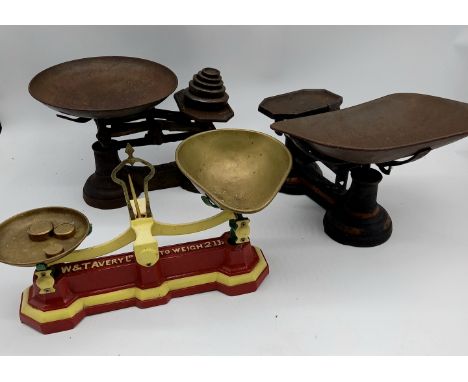 Three sets of assorted vintage scales and some weights.