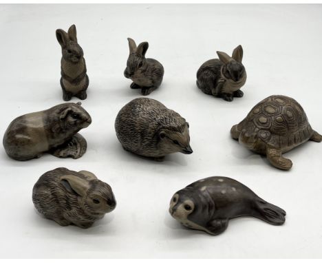 A collection of Poole Pottery stoneware animals including hedgehog, tortoise, rabbits, guinea pig, seal etc.
