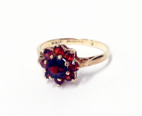 A hallmarked 375 gold garnet cluster ring