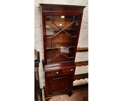 A 56cm 20th Century reproduction mahogany book cabinet with dentil cornice and shelves enclosed by an astragal glazed panel d