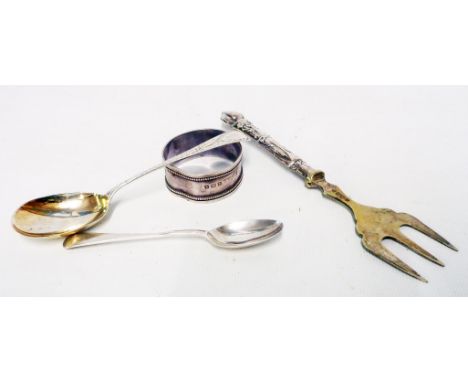 Two small silver spoons, napkin ring and a silver handled muffin fork