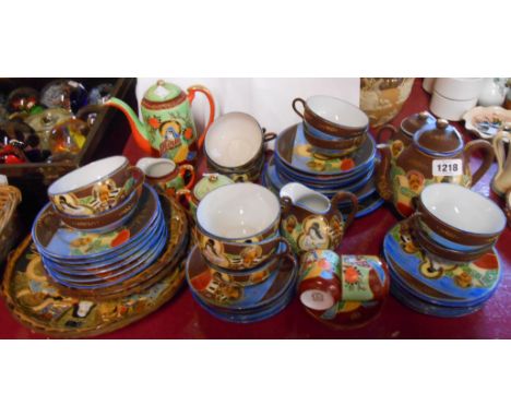 A Japanese moriage porcelain twelve place tea service - sold with a similar part coffee service