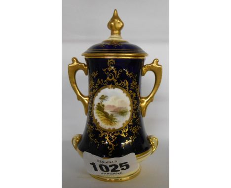 A Coalport miniature two handled urn decorated with a central panel depicting a lakeside scene on cobalt ground with gilt hig