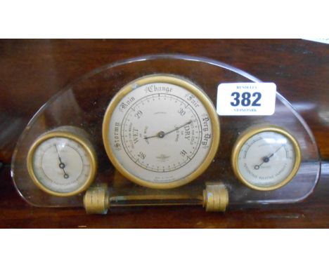 An Art Deco peach glass and gilt metal three dial aneroid weather station by Shortland Smiths - barometer glass missing