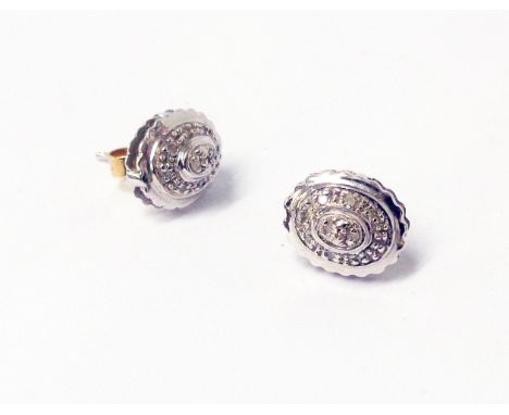 A pair of marked 10k/417 white metal oval panel diamond set ear-rings