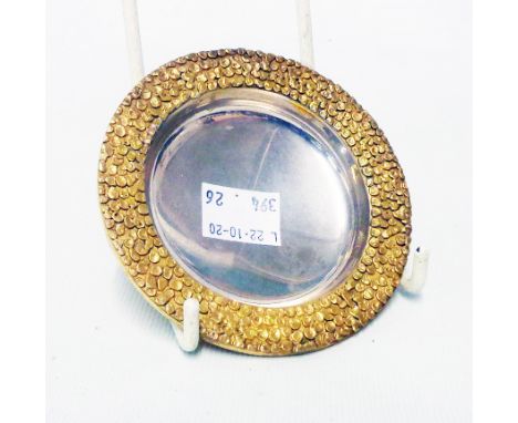 A 9cm diameter Stuart Devlin silver gilt pin tray with granulated rim - London 1972