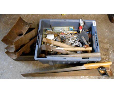 A box of tools including saws, drills, hammers, etc.