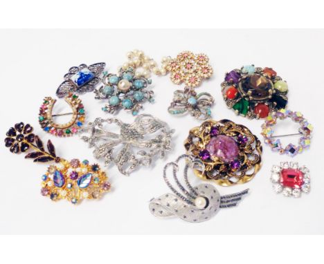 A collection of vintage costume jewellery and other brooches including a 1950's S.J. Ltd. silver ornate scroll form brooch, s