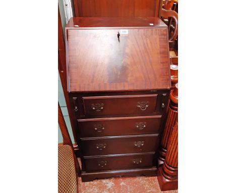 A 51cm 20th Century reproduction mahogany and cross banded bureau with part fitted interior and three long drawers under, set