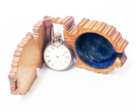 A vintage anodised cased Omega lever fob watch - sold with an associated decorative carved wood watch stand