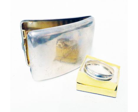 A silver curved form cigarette case bearing engraved initials - sold with a small silver napkin ring