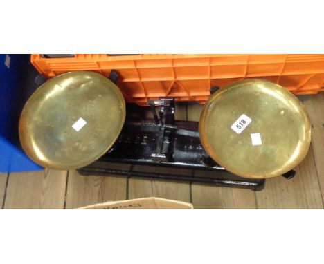 A set of vintage balance scales with brass pans