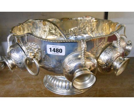 A silver plated punch bowl with lion mask ring handles and six cups, a parcel gilt kings pattern ladle and a dish