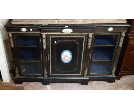 A 1.65m late Victorian ebonised and boxwood strung breakfront credenza with cast brass decorative embellishments and four ova