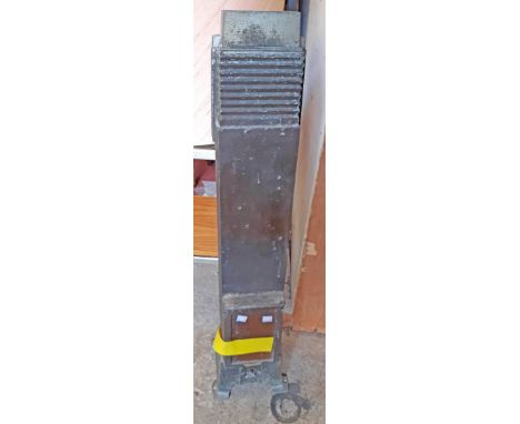 A 95cm high vintage Cannon painted metal tower gas heater with glazed panel door to front, set on bracket feet