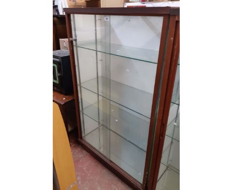 A 93cm vintage shop display cabinet with painted and clear glass panel and shelves enclosed by pair of glass sliding doors - 