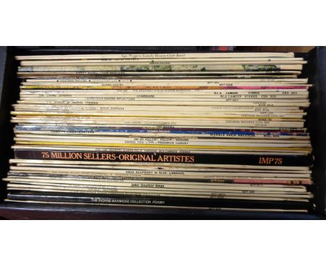 A case containing vintage vinyl LP records, including The Beatles, Labi Siffre and Top of the Pops, etc.