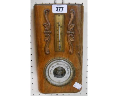 An early 20th Century polished wood cased wall barometer/thermometer with visible aneroid works to dial centre - a/f