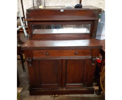 A 103cm Victorian walnut chiffonier with mirror set raised back and flanking spindles to shelf over a base with long frieze d