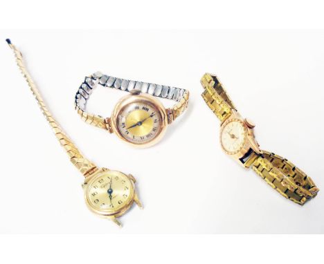 An import marked vintage 9ct. gold cased lady's wristwatch with plated expanding strap - sold with two goldtone cased lady's 