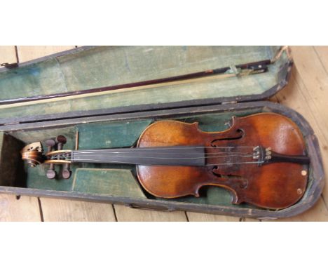 An antique Stradivarius copy violin with bow in wooden case