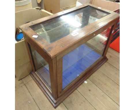 A vintage oak framed vitrine - as a display case with later shelf