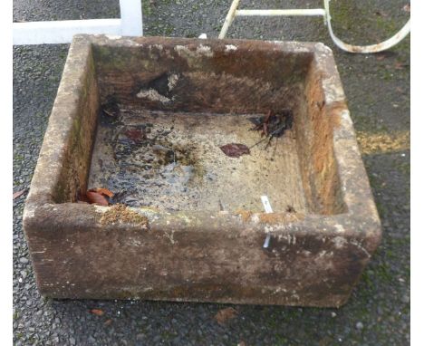A square stone trough