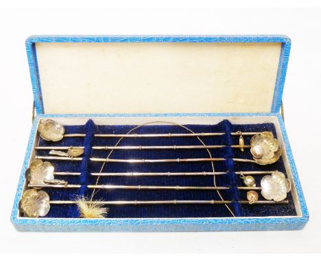 A boxed set of six vintage oriental marked sterling/950 sipper spoons with long bamboo effect stems, applied pendants and pet