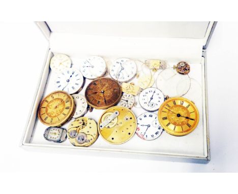 A box containing vintage wristwatch and pocket watch movements and crystals - various condition