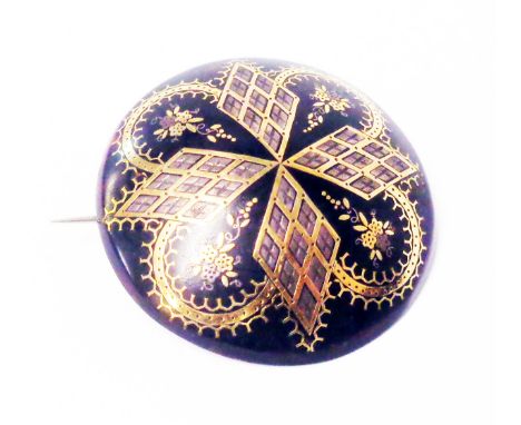 A vintage circular tortoiseshell dome shaped brooch with decorative pique work inlay - chips to back