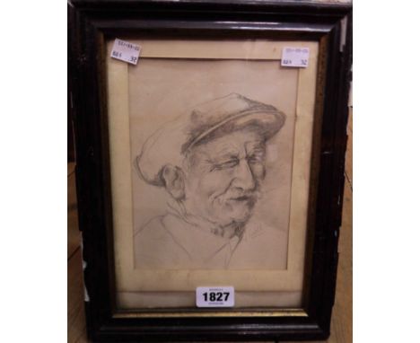 A framed pencil portrait of a man wearing a cap - indistinctly signed