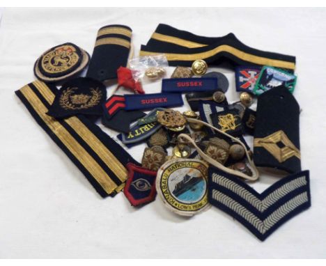 A bag containing British Army embroidered and other insignia, etc.