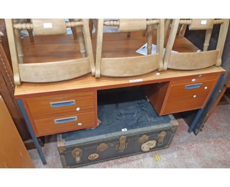 A 1.36m vintage teak effect kneehole office desk with two short drawers and flanking locking file drawer, set on painted meta