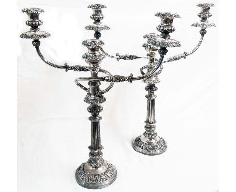 A pair of 53.5cm high antique silver plated copper twin branch three light candelabra with detachable top sections and nozzle