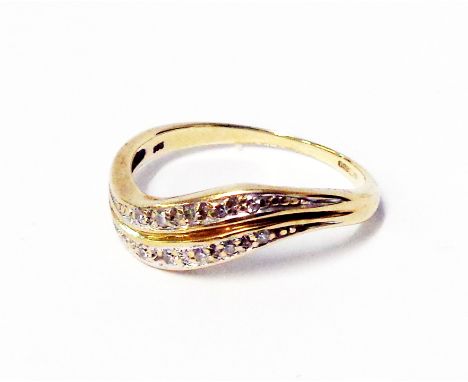A marked 375 yellow metal ring with two rows of tiny diamonds in wave setting